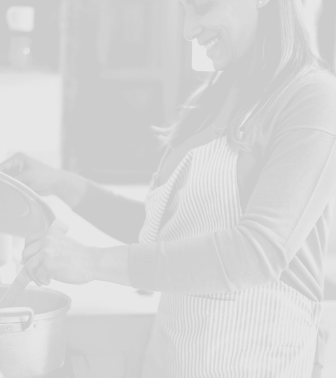 White tone on tone image of a home cook cooking on a stove